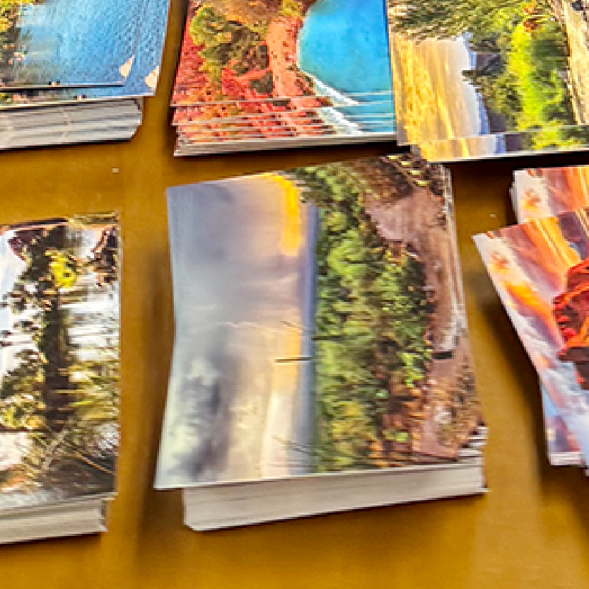 Stacks of water-themed postcards.